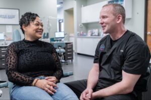 Patient talking to Federal Way orthodontist Dr. Clawson.